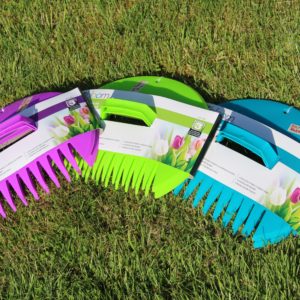 three hand rakes in different colors